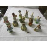 12 boxed John Beswick Beatrix Potter figurines.