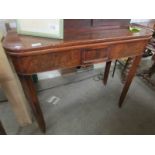 A Victorian mahogany fold over tea/games table.