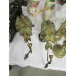 A pair of art nouveau brass wall candle sconces.