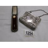 An ornate German silver 'Art Nouveau' purse and a 19th century yellow metal stick pin in original