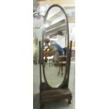 An oval cheval mirror.