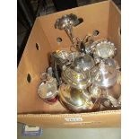 A box of assorted silver plate including teapots etc.