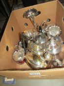 A box of assorted silver plate including teapots etc.