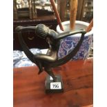 An art deco style metal figure of a dancing lady