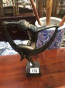 An art deco style metal figure of a dancing lady