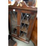 A lead glazed corner cupboard.