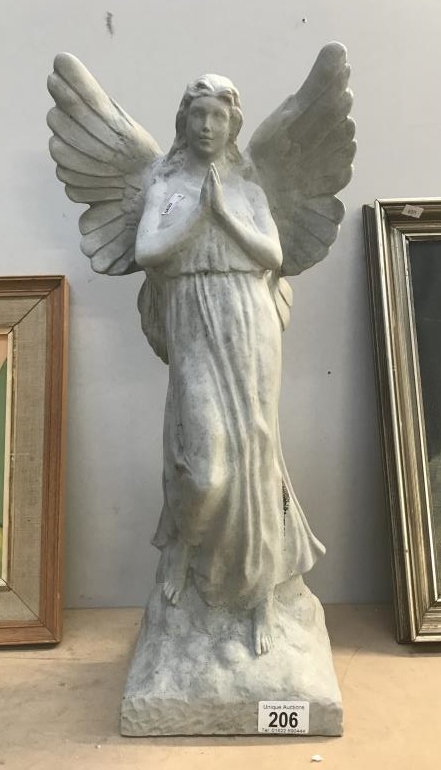 A concrete effect garden ornament of an angel