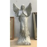 A concrete effect garden ornament of an angel