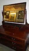 An Edwardian cross banded dressing table, mirror slightly a/f).