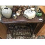 A 1930's oak side table with barley twist legs