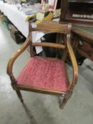 An oak elbow chair.