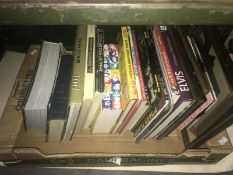 A box of assorted music books