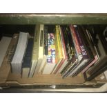 A box of assorted music books