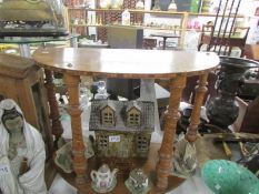 A small D shaped 2 tier table with inlay.