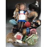 A box of old small dolls