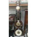 A modern antique style barometer wall clock