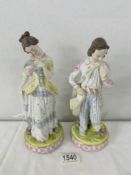 A pair of 19th century bisque porcelain figures. 24 cm tall.