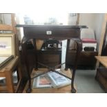 An Edwardian mahogany tea table on Queen Anne legs