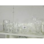 3 good quality cut glass vases and 5 good quality cut glass jugs.