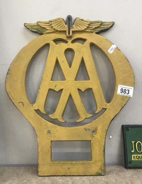 A vintage cast iron alluminium AA road sign