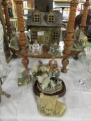 A collection of David Winter cottages and pottery cottages (7 items).