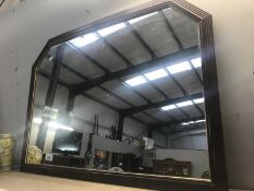A darkwood framed mirror