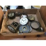 A box of old clock part movements etc.