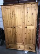 A pine 3 door 2 drawer wardrobe