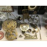 A quantity of brass ware including trivets and picture stands etc.