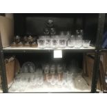 2 shelves of mainly drinking glasses, a glass bowl,