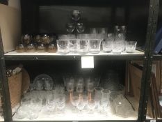 2 shelves of mainly drinking glasses, a glass bowl,