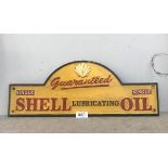 A cast iron Shell lubricating oil advertising sign