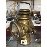 An Edwardian brass Howes & Burley no: 1007 side lamp