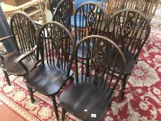 A set of 6 wheel back dining chairs