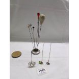 A silver hat pin stand, Chester 1907/07, a/f with hat pins including 2 insect examples.