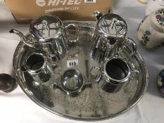 A 4 piece silver plated tea set together with a tray and tea drip bowl