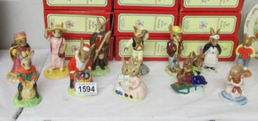 12 boxed Royal Doulton Bunnikins figures.