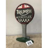 A cast iron Triumph motorcycles advertising sign
