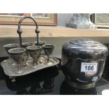 A silver plated egg cup stand and biscuit barrel