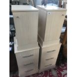 A pair of beech effect bedside chest of drawers and a pair of cupboards