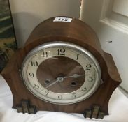 An Edwardian oak mantle clock