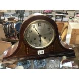 An inlaid Edwardian mahogany mantle clock with silvered dial by Hy Lee & Sons,