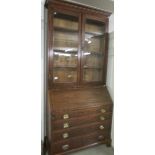 A mahogany inlaid bureau book case.