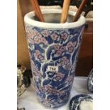 A blue and pink floral umbrella stand