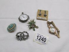 A mixed lot of costume jewellery, a ladies wrist watch and a silver pocket watch.