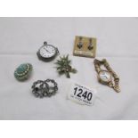 A mixed lot of costume jewellery, a ladies wrist watch and a silver pocket watch.