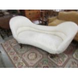 A cream double ended chaise longue.