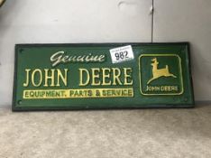 A cast iron John Deere advertising sign