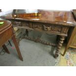 An 18th century carved oak table on barley twist legs with barley twist stretched and unusual