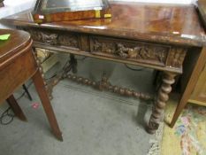 An 18th century carved oak table on barley twist legs with barley twist stretched and unusual